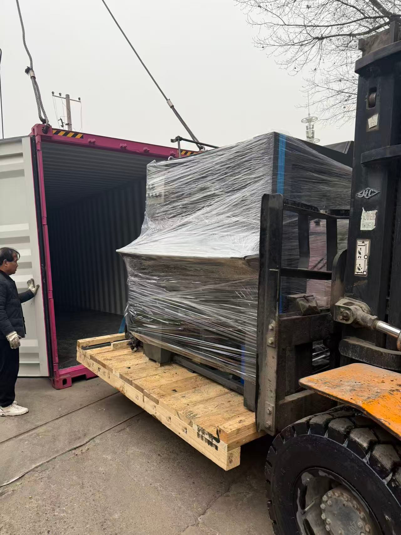 Printing machine container loading and shipping